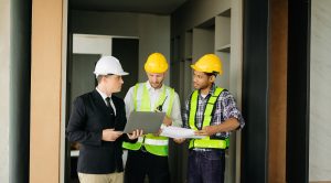 Retail contractors reviewing construction plans during a commercial property walkthrough